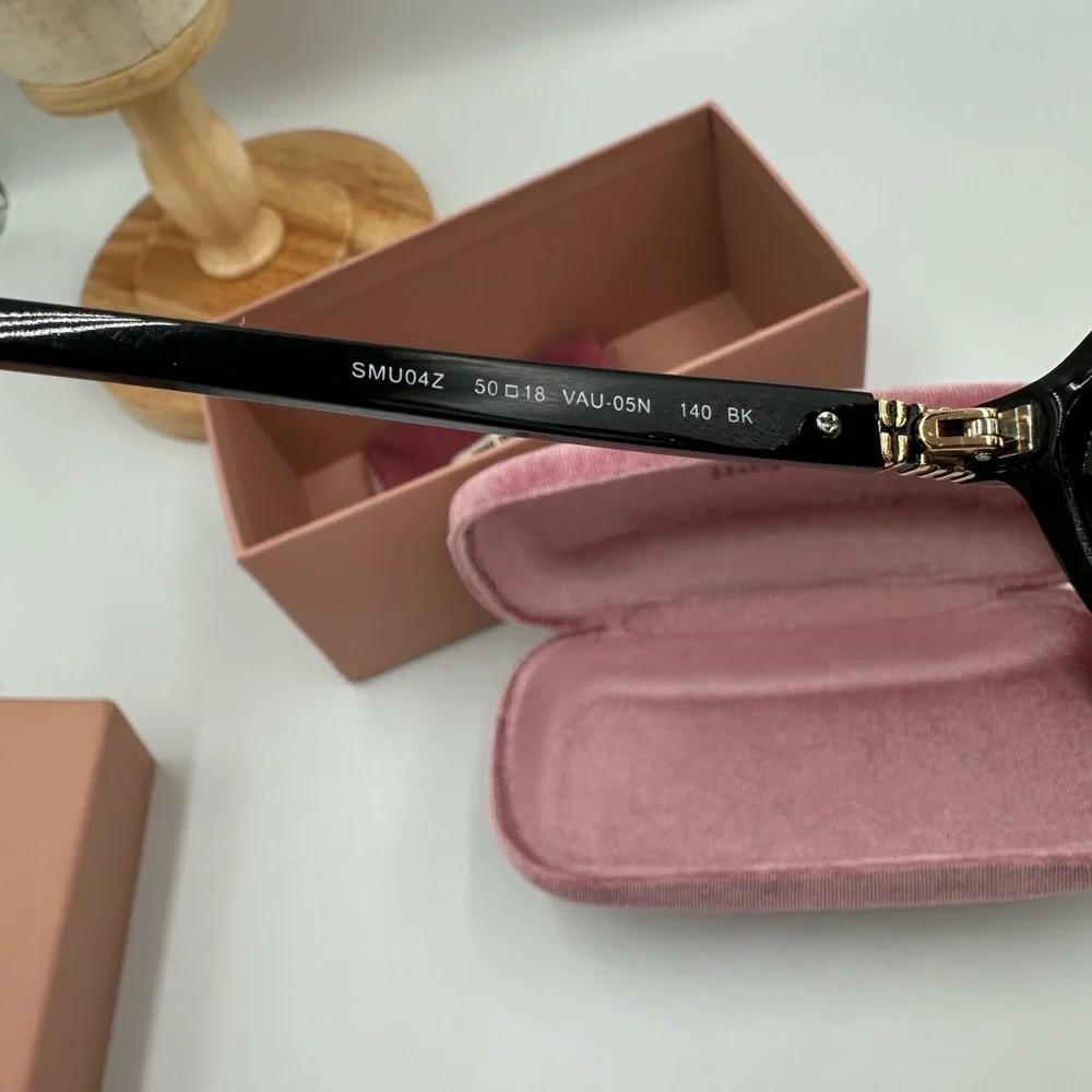 Miu Miu SMU04Z Black Oval Elegant Sunglasses Summer Collection Made Italy